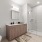glassed, walk-in shower in well lit bathroom