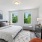 bright windows and light fixture in bedroom