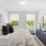 natural lighting pours through windows in bedroom