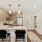 storage and washer/dryer closets next to well lit kitchen