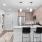 spacious kitchen  with recessed lighting next to washer/dryer closet