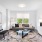 large, furnished living room with light fixture